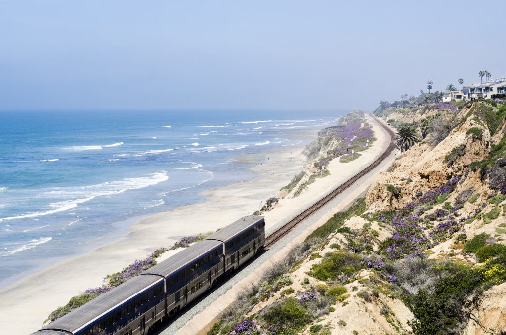 A train. sustainable travel means traveling by train more