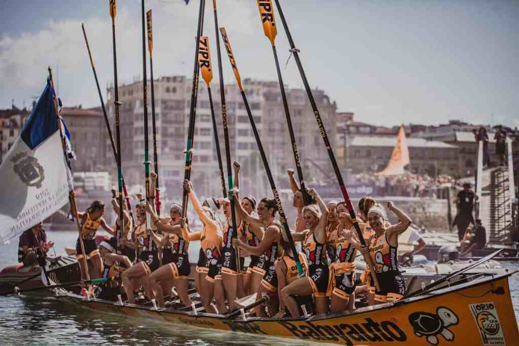 women in boat september in san sebastian